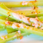 Crunchy Celery Sticks Paired with Zesty Pimento Cheese Delight