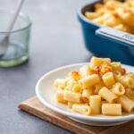 Golden brown Macaroni Cheese bubbling in a cast iron dish, Southern comfort at its best.