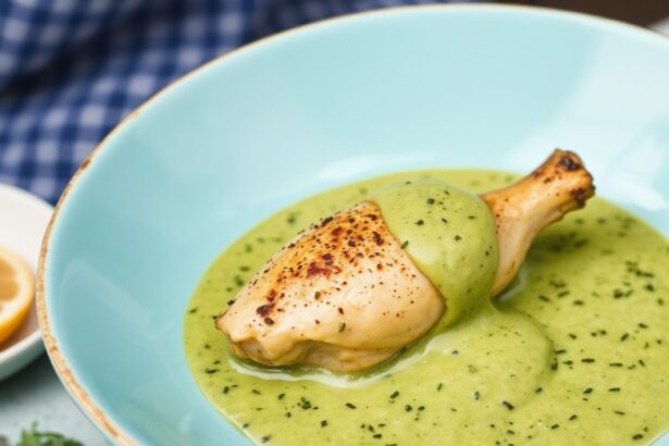Peruvian chicken masterclass plate with creamy green sauce, cilantro, lime wedges.