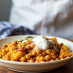 Hearty butternut chickpea bake, a cozy autumn comfort food.