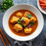 Rich, complex Massaman curry with fragrant spices, a true culinary masterpiece.