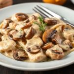 Creamy chicken mushroom stroganoff with herbs, a comforting reimagined classic.