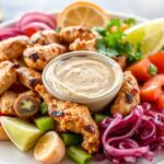 Perfect chicken shawarma platter with tahini sauce, a culinary journey.
