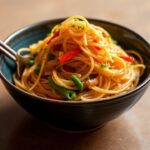 Vibrant Korean Japchae, a delicious noodle dish, showcasing its soul.
