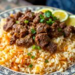 Steaming Uzbek Plov, rich with spices, aroma of ancestry.