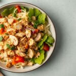Asian chicken salad: A symphony of textures and flavors.