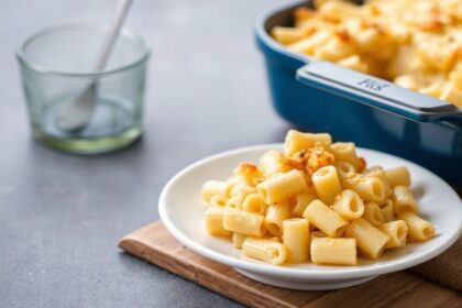 Golden brown Macaroni Cheese bubbling in a cast iron dish, Southern comfort at its best.