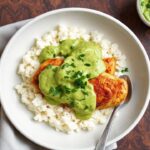 Juicy Peruvian chicken smothered in creamy green sauce with lime and cilantro.