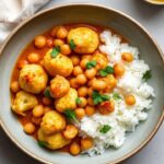 Rich cauliflower curry, a culinary journey from humble origins to global fame.