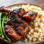 Authentic Jamaican jerk chicken with rice and peas, a culinary masterclass.