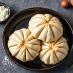 Warm, golden Russian beef piroshki, a comforting, artisanal delight.