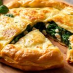 Golden spanakopita, a savory Greek spinach pie, ready to serve.
